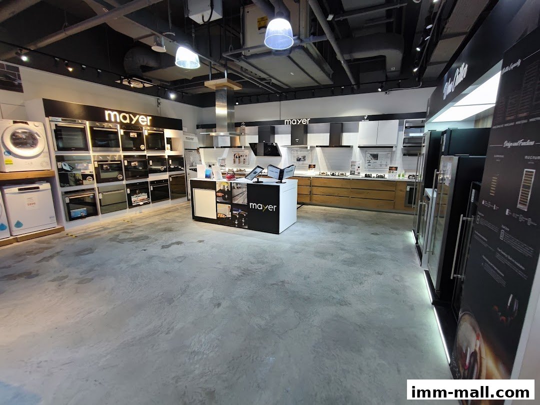 Interior view of a Mayer showroom displaying various kitchen appliances and home electronics.