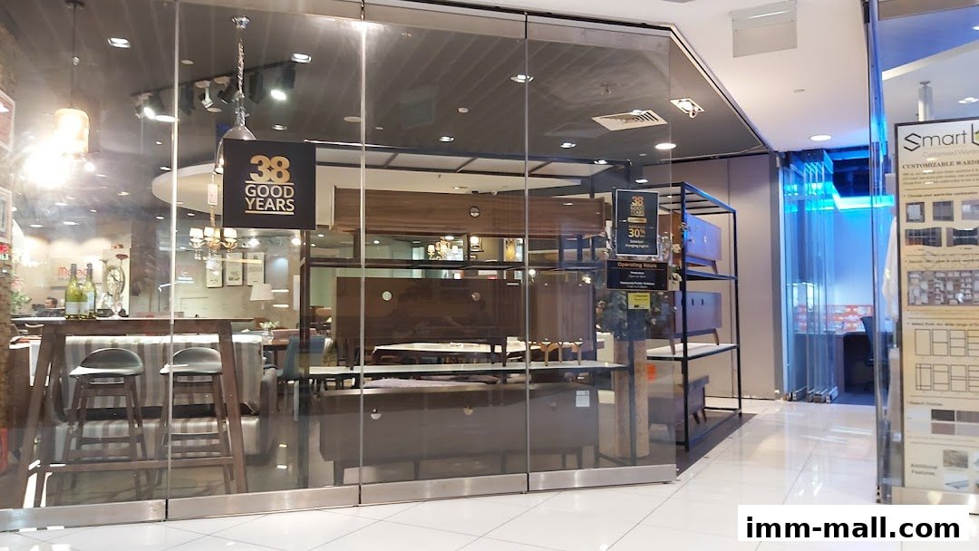 Mondi shop interior featuring furniture displays and a '38 Good Years' sign.