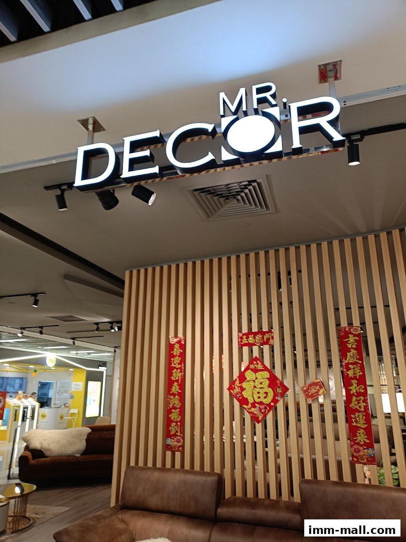 Interior view of Mr Decor Furniture Gallery with a prominent sign and modern furniture.