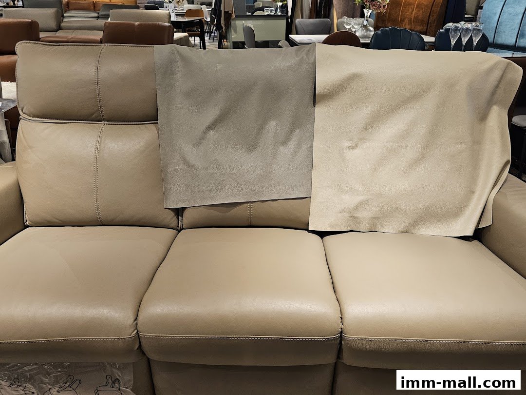 Close-up of a beige leather sofa with swatches of different leather textures and colors.