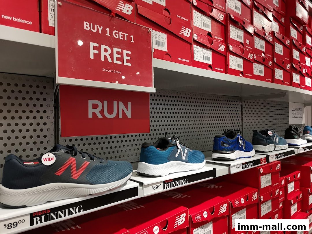 New Balance shoes on display with a 'Buy 1 Get 1 Free' offer and 'Run' signage.