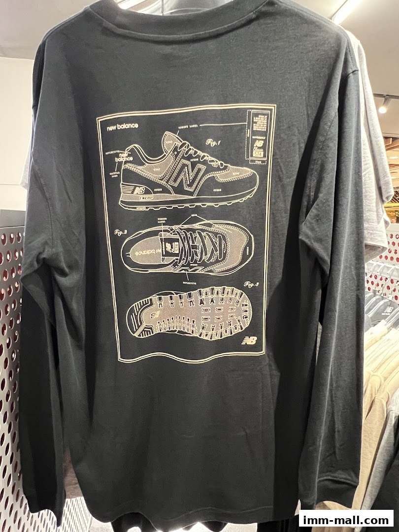 A black long-sleeved t-shirt with a detailed diagram of a New Balance sneaker.