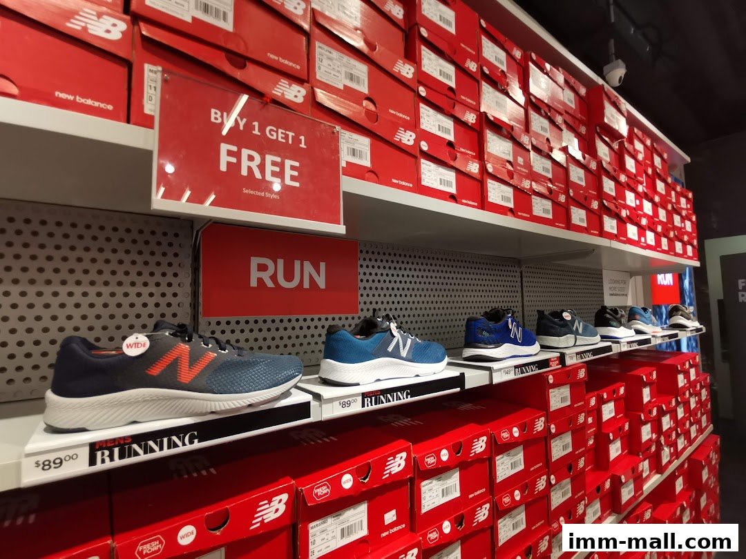 New Balance shoes and boxes displayed on shelves, with a 'Buy 1 Get 1 Free' sign.