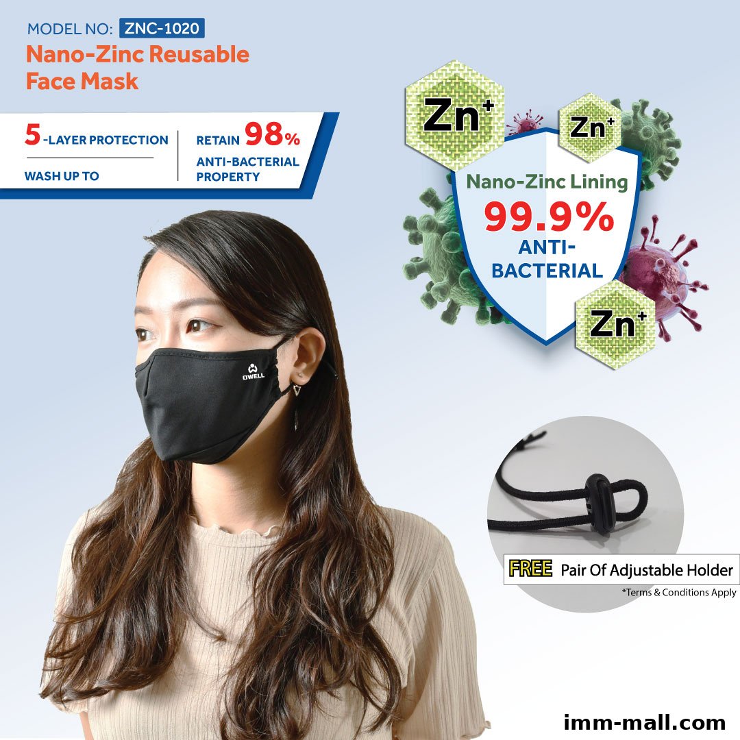 A woman wearing a black reusable face mask with information about its features.