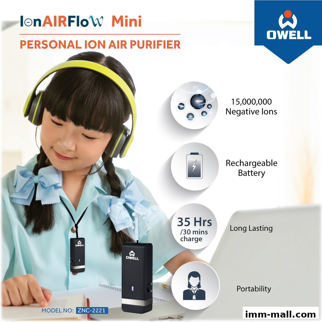 A young girl wearing headphones uses a personal ion air purifier.