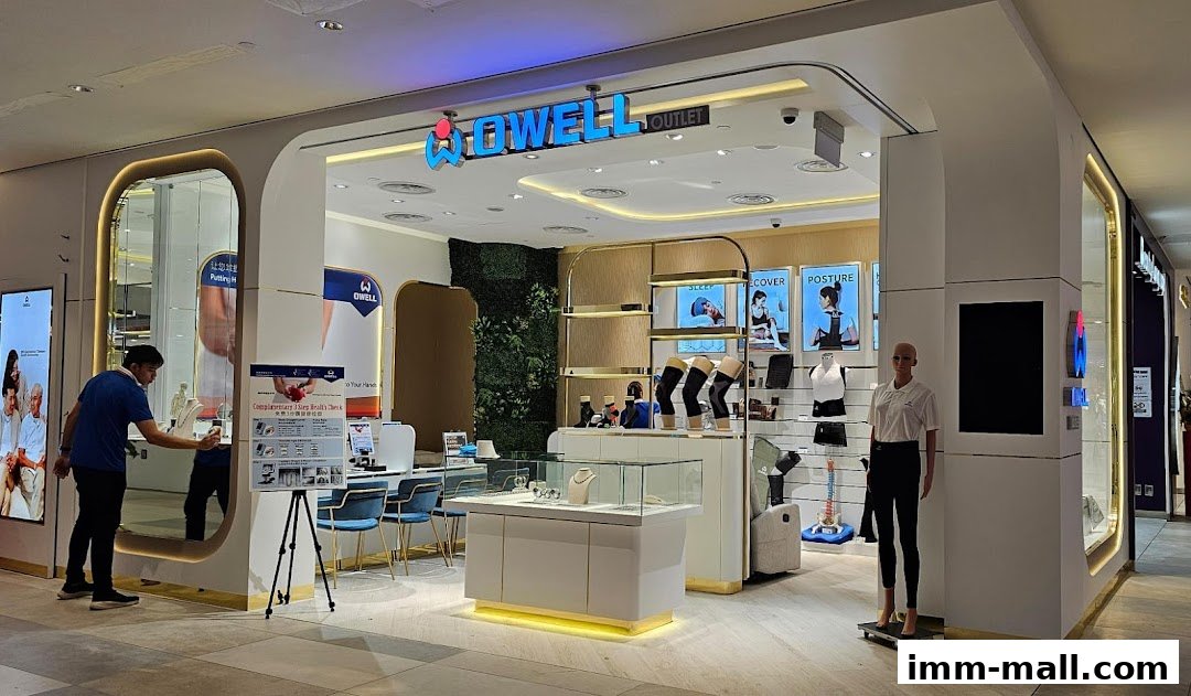 The Owell Bodycare outlet shop front displays health and posture products with mannequins and displays.