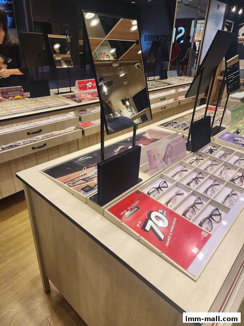 A display of eyeglasses and sunglasses with a prominent "70% OFF" sale sign.