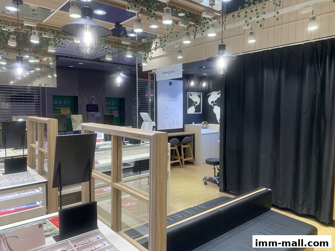 Interior view of an optical shop with display shelves, seating, and a reception area.