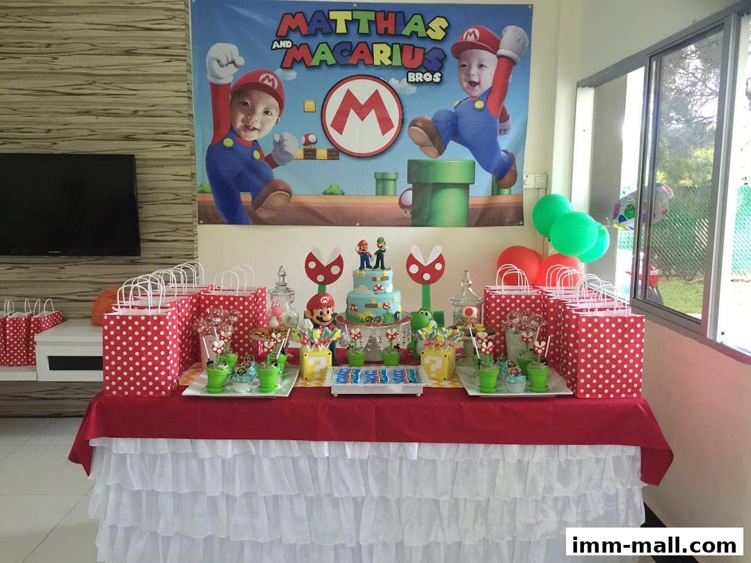 A table decorated for a Super Mario-themed birthday party with a cake, goodie bags, and balloons.