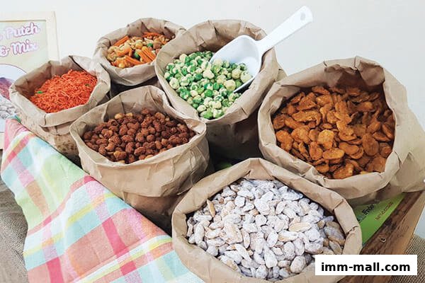 Bags of assorted snacks, including nuts and crackers, displayed for sale.