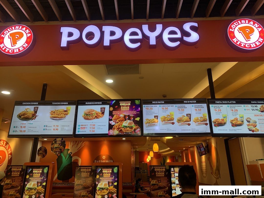 A bright and inviting menu display for Popeyes Louisiana Kitchen, showcasing various chicken, tender, and burger combos.