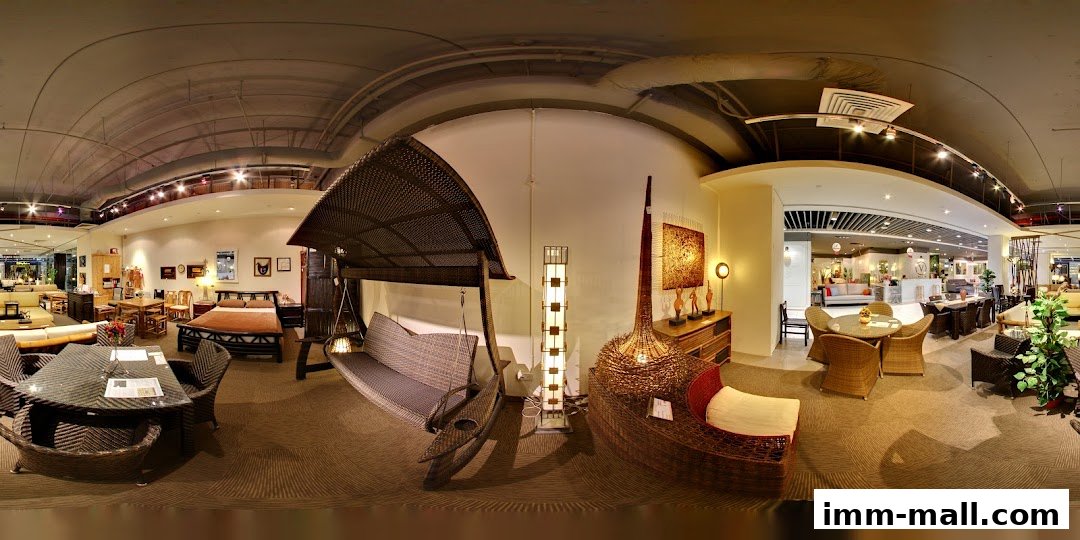 Interior view of a furniture store showcasing rattan and wicker indoor and outdoor furniture.