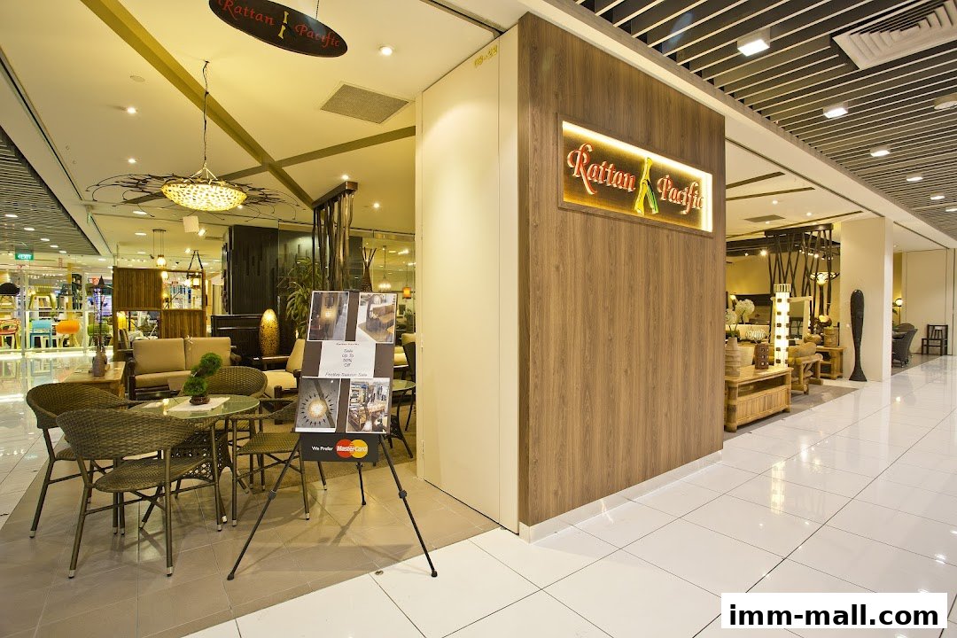 Rattan Pacific shop entrance with display of rattan furniture and a promotional stand.