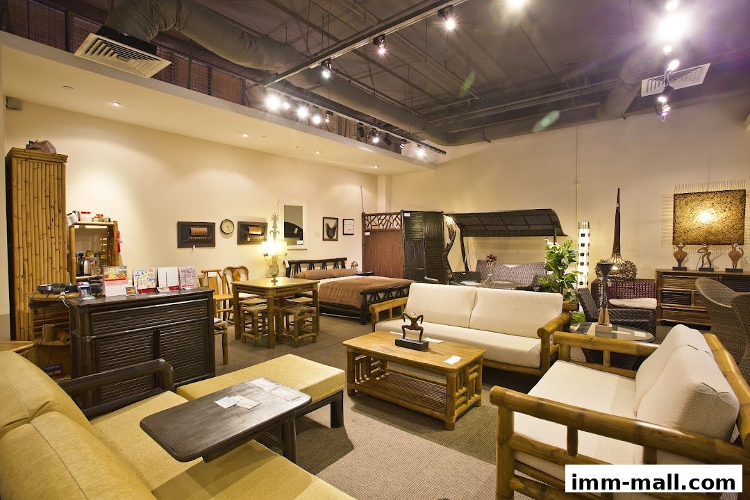 Interior view of Rattan Pacific furniture store showcasing various rattan furniture sets.