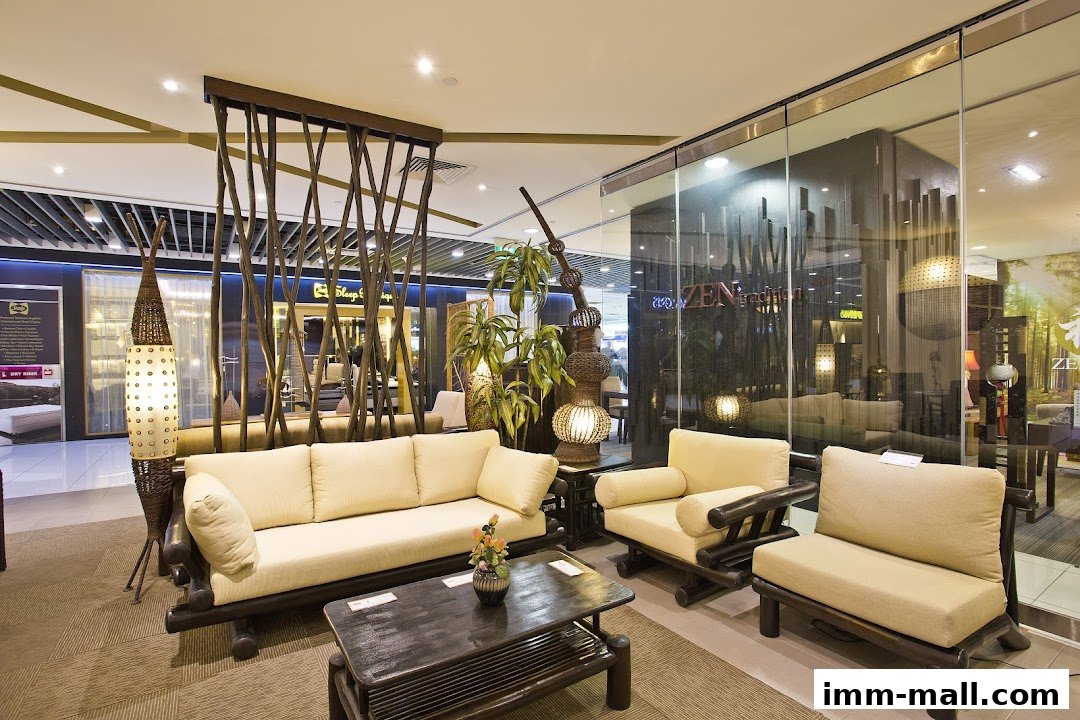A stylish living room set with a rattan sofa, armchairs, and coffee table, illuminated by unique lamps.