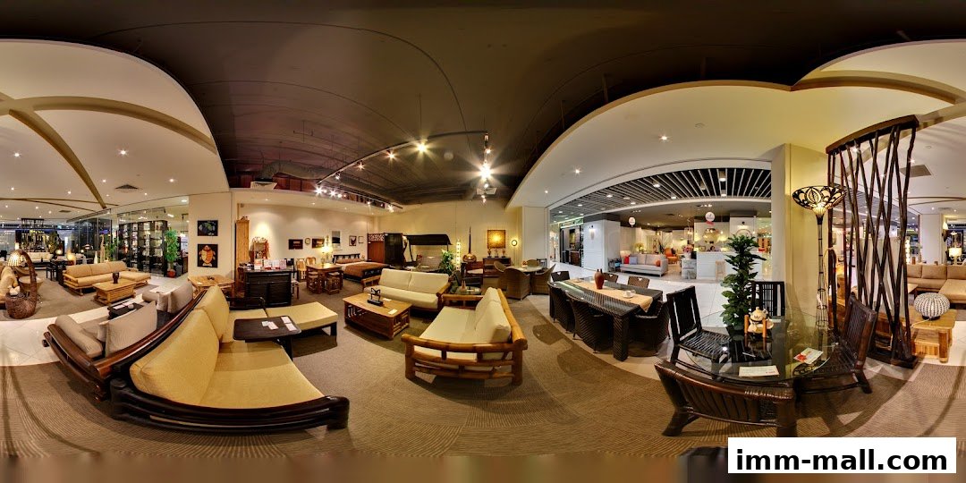 Interior view of Rattan Pacific furniture store showcasing various rattan and wooden furniture sets.