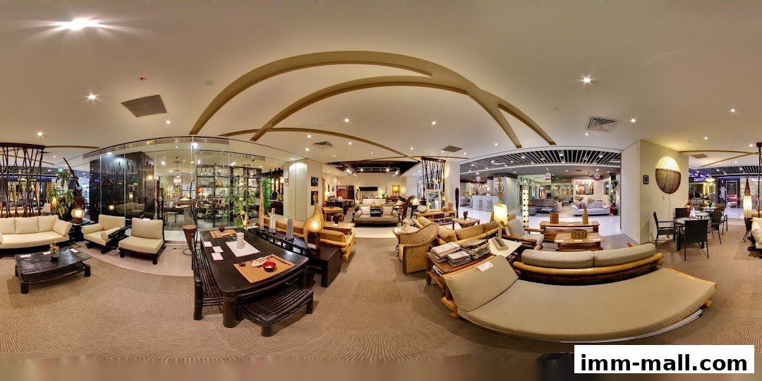 Interior view of a well-lit furniture store showcasing various living room sets and decor.