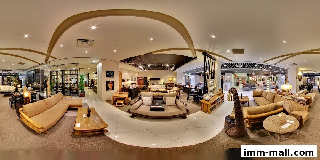 Interior view of a furniture store showcasing various rattan and wooden furniture pieces.