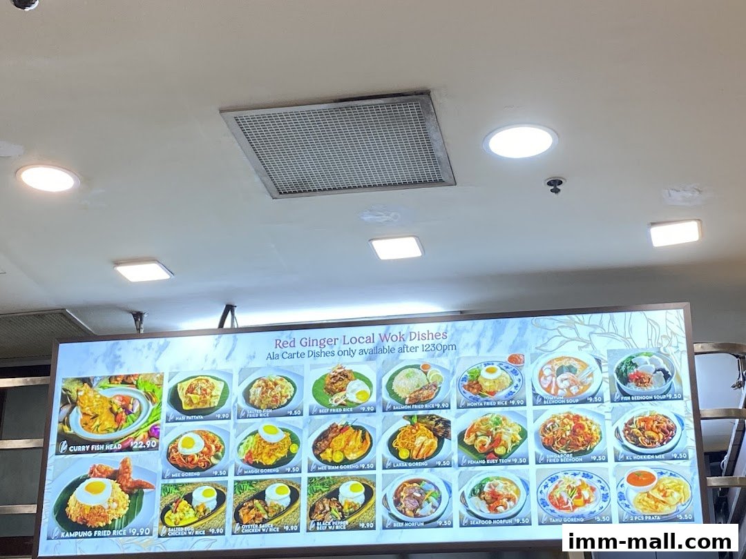 A brightly lit menu board displaying various local wok dishes with enticing images and prices.