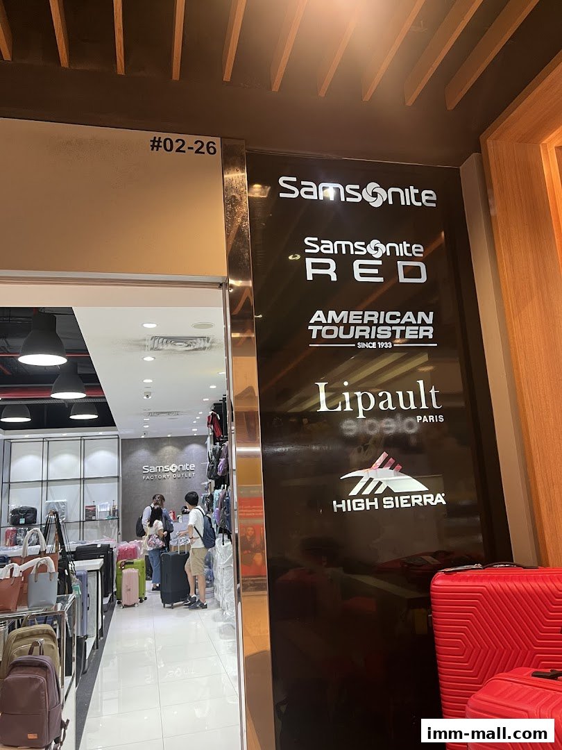 The entrance to a Samsonite Factory Outlet store showcasing various luggage brands.
