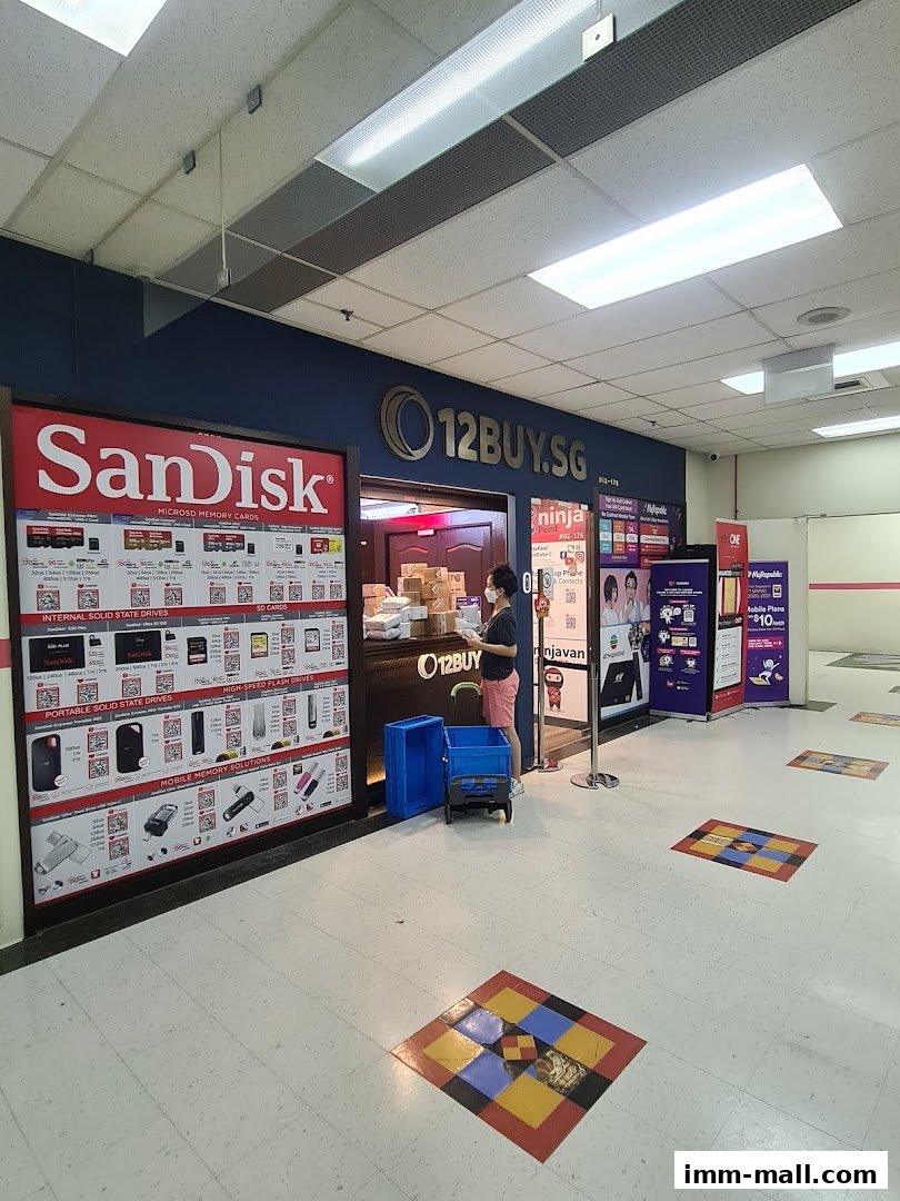 The SanDisk 12BUY.SG shop front displays various storage solutions and has a staff member at the counter.