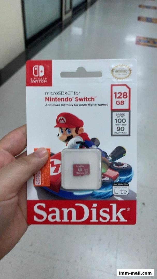 A hand holds a SanDisk 128GB microSDXC card for Nintendo Switch featuring Mario.