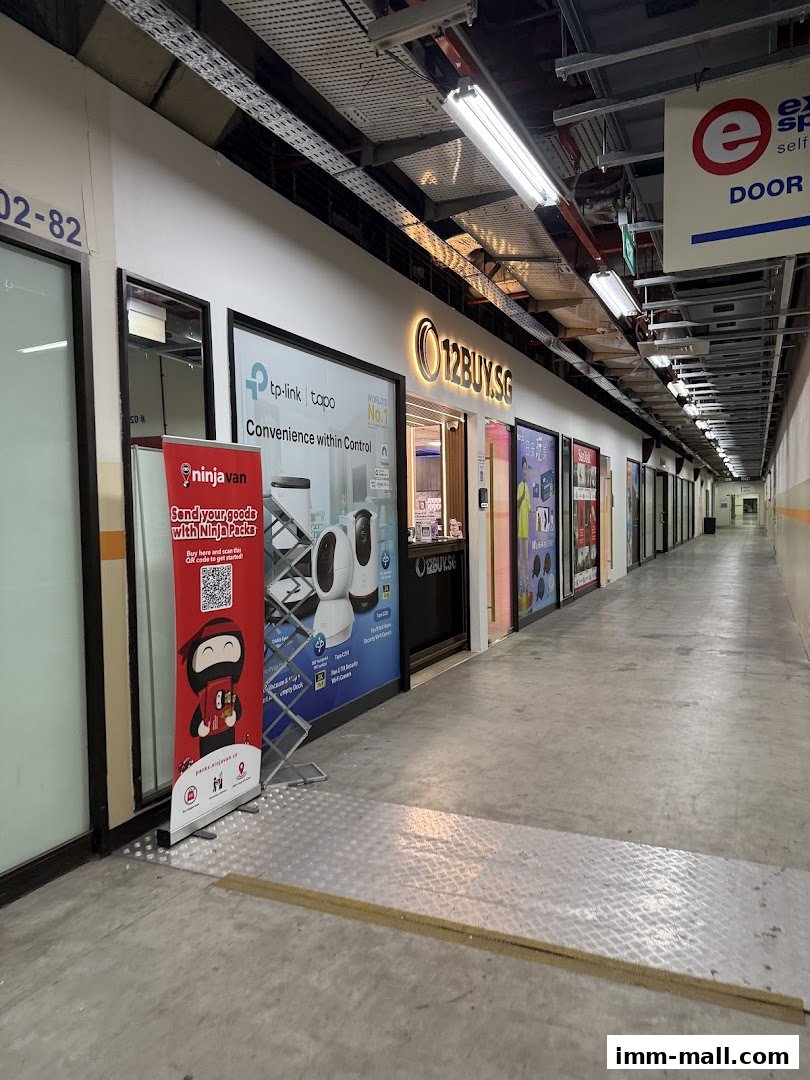 The storefront of 12BUY.SG, a retail shop, with promotional displays and signage.