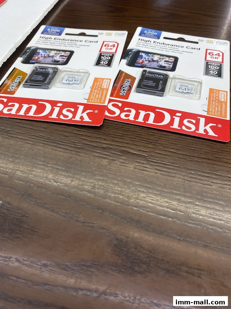 Two packages of SanDisk 64GB High Endurance microSD cards with adapters.