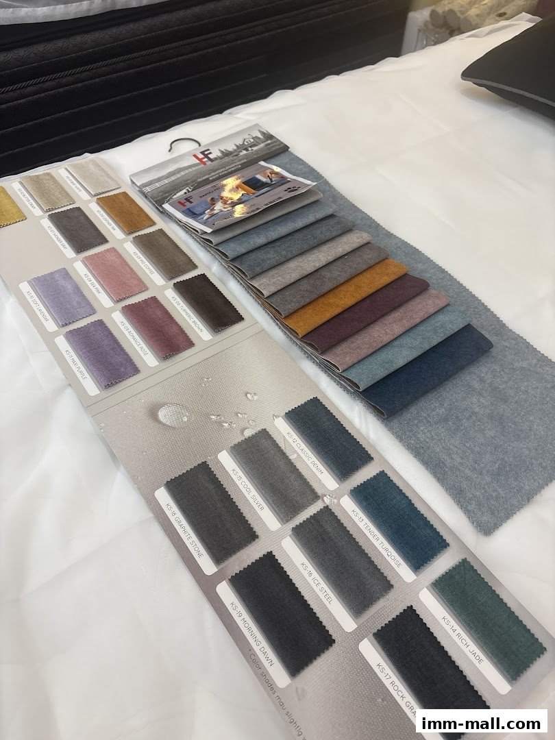 Fabric swatches for upholstery in various colors and textures are displayed on a white surface.