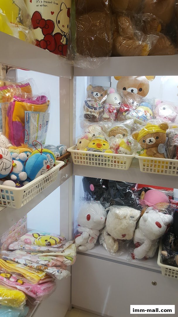 Shelves filled with various plush toys and character merchandise, including Doraemon and Rilakkuma.