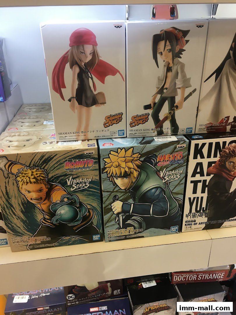 Shelves filled with anime and superhero action figures in their original packaging.