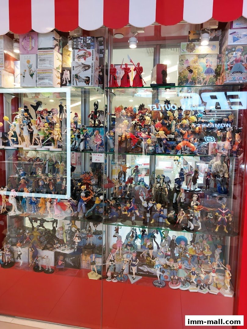 A display window filled with anime figurines and collectibles.