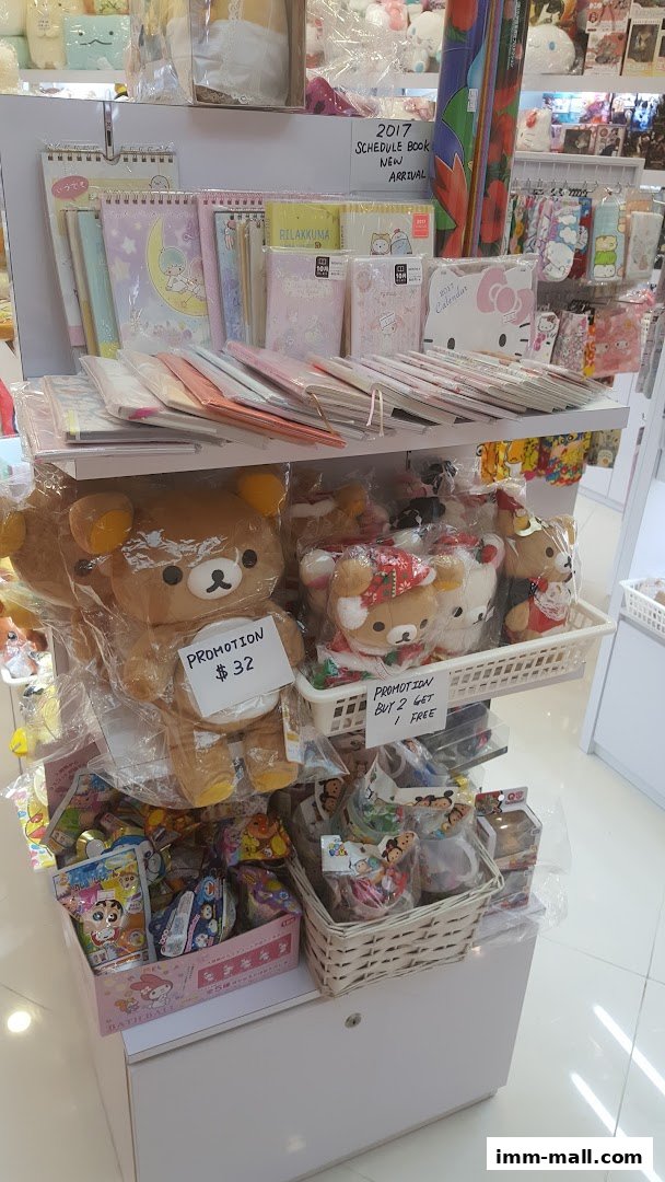 A retail display featuring plush toys, stationery, and various character merchandise.