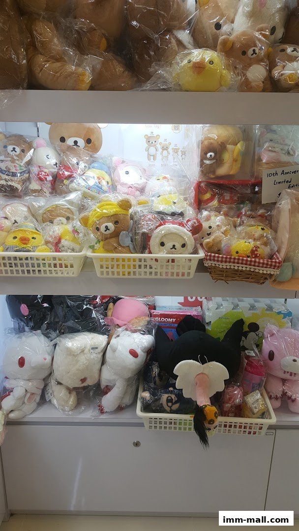 Shelves filled with various plush toys, including bears, chicks, and other characters.