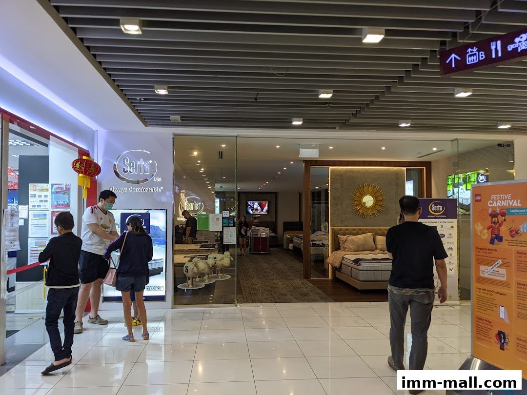 People entering a Serta Sleep Center store showcasing beds and mattresses.