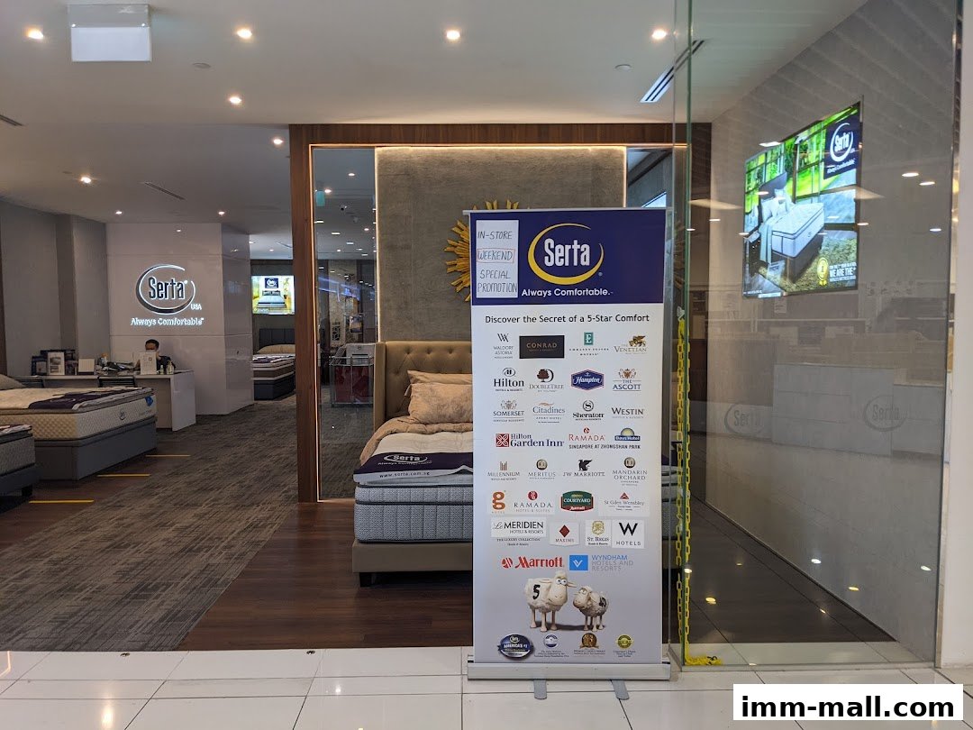 Interior view of a Serta Sleep Center showcasing mattresses and a promotional banner.