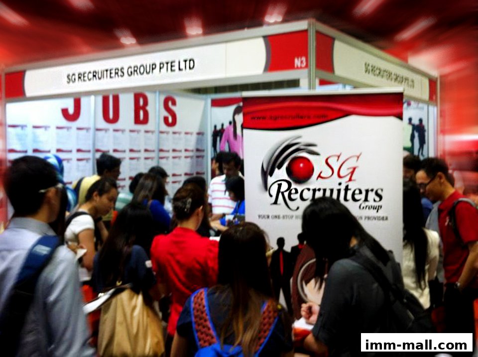 People gathered at a recruitment fair booth for SG Recruiters Group Pte Ltd.