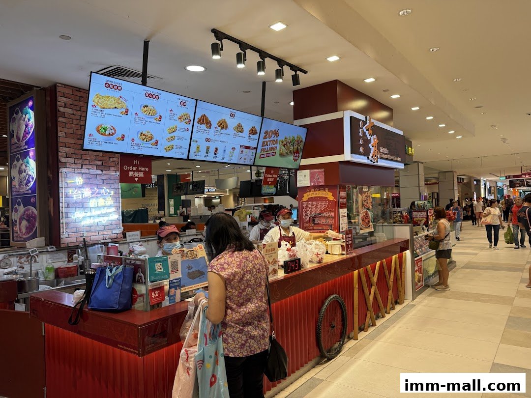 A Shihlin Taiwan Street Snacks stall with a digital menu and customers ordering food.
