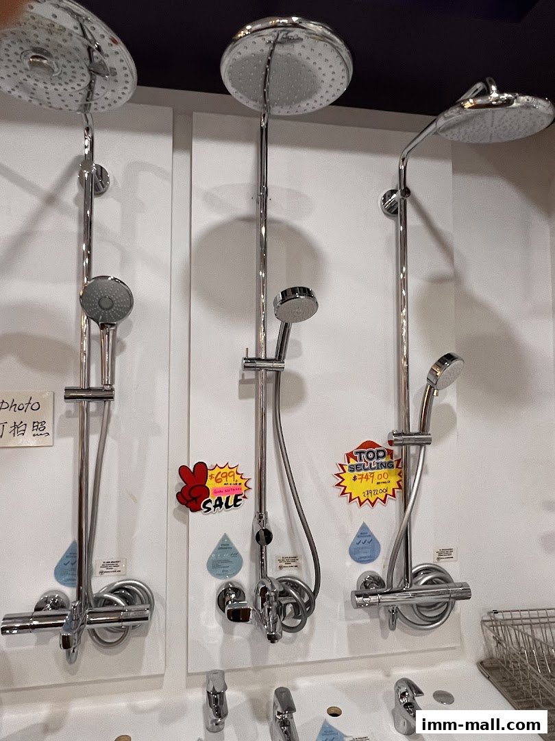 Display of modern shower systems with various showerheads and controls.