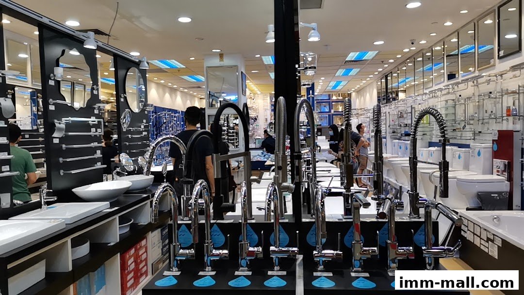 Interior view of a bathroom fixtures store showcasing various faucets, sinks, and toilets.