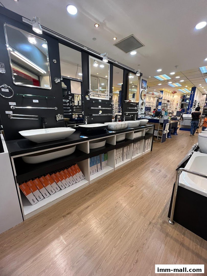Interior view of a bathroom fixtures store showcasing sinks, mirrors, and accessories.