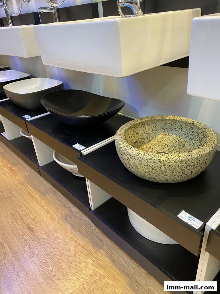 A display of various modern bathroom sinks and basins in different styles and colors.