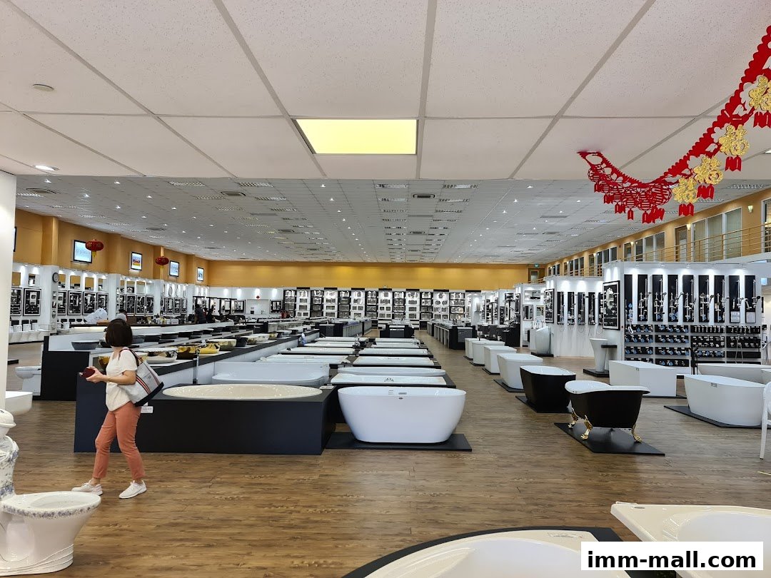 A wide view of a spacious bathroom showroom with numerous bathtubs and bathroom fixtures on display.
