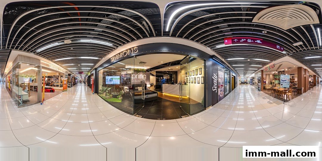 The Simmons Gallery shop front with a display of mattresses and a modern interior.