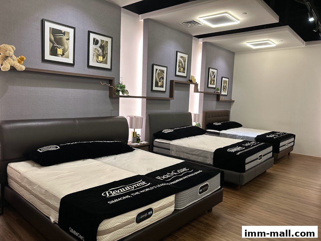 A Simmons Gallery showroom displaying multiple beds with mattresses and headboards.