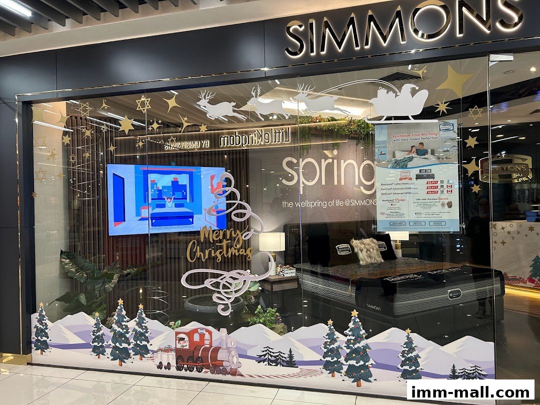 Simmons Gallery shop front with Christmas decorations and a display bed.