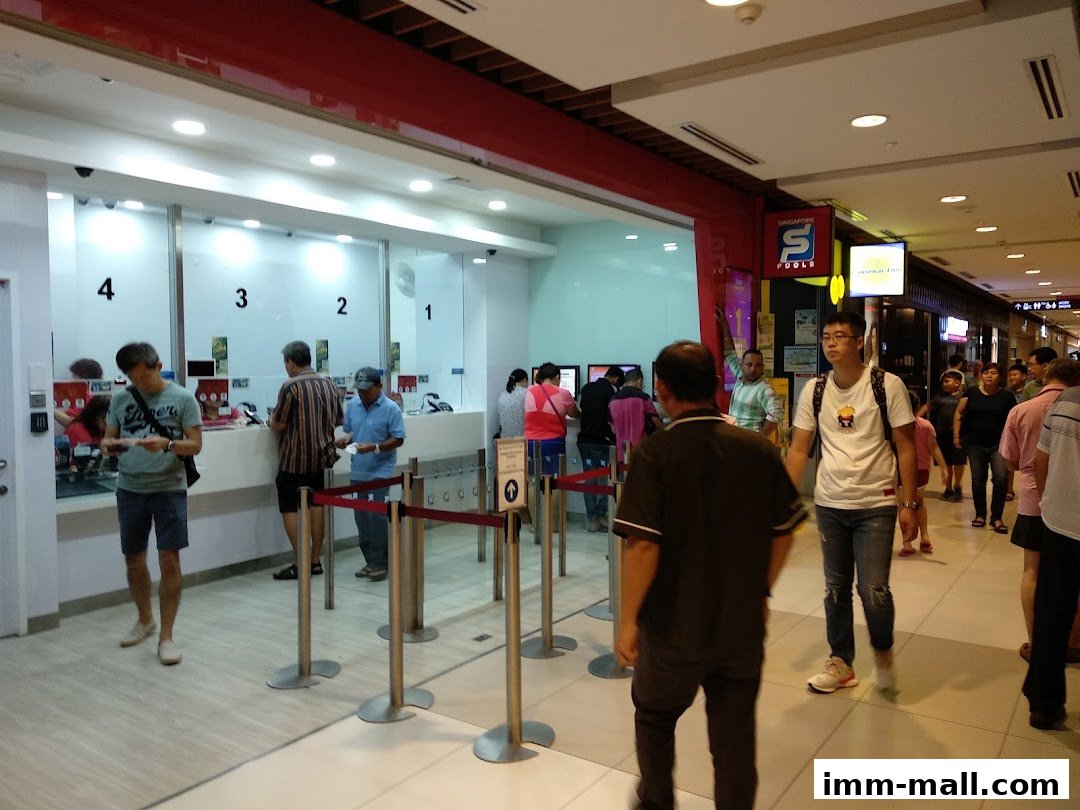 People queuing at the Singapore Pools counter in a shopping mall.
