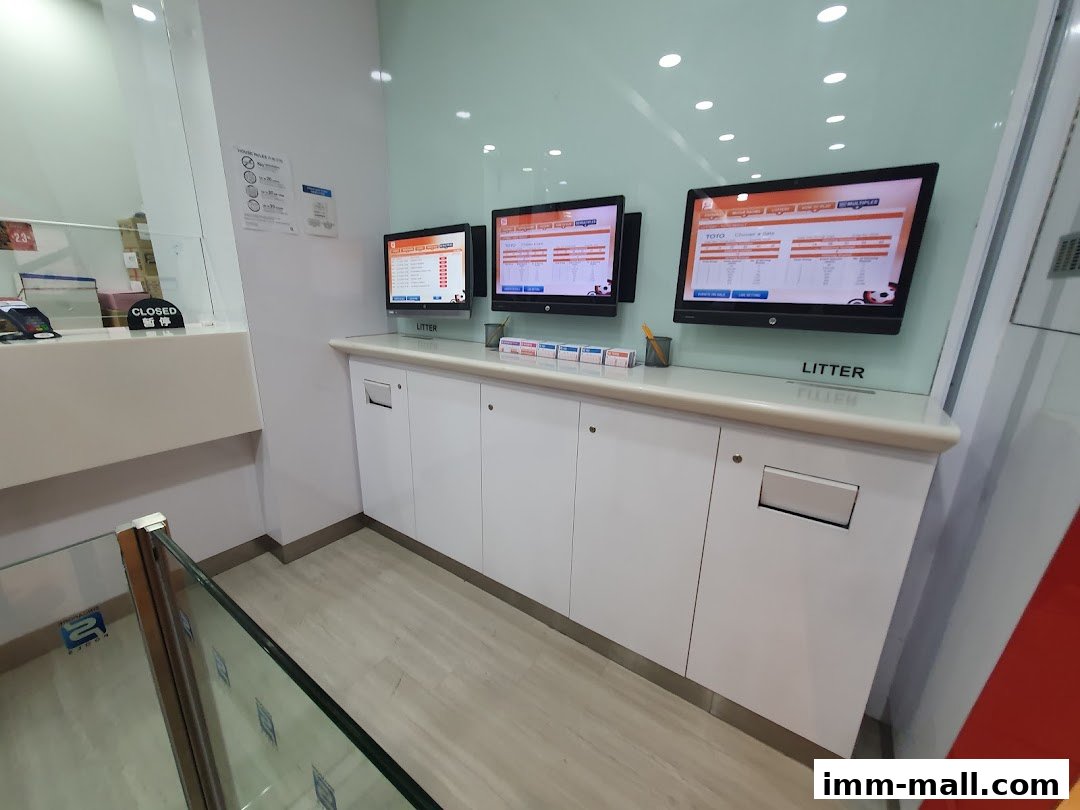Interior view of Singapore Pools with multiple screens displaying lottery information.