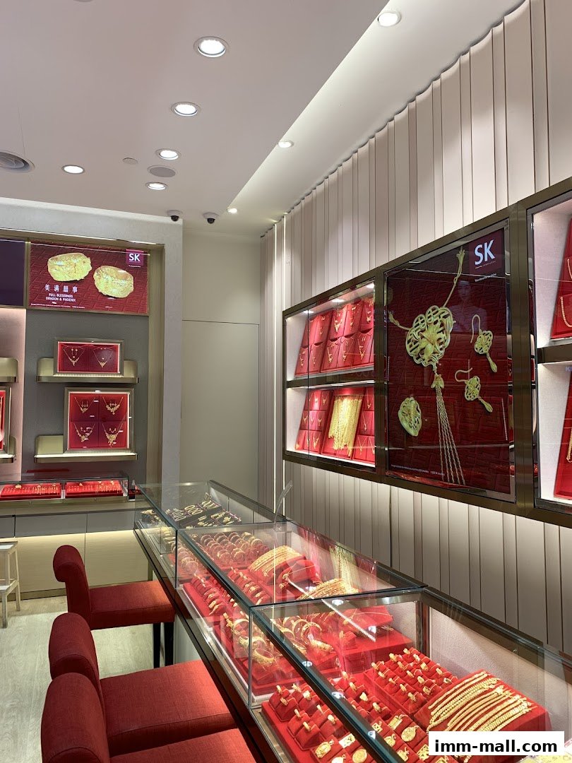 Interior view of SK Jewellery shop showcasing display cases filled with gold jewelry.