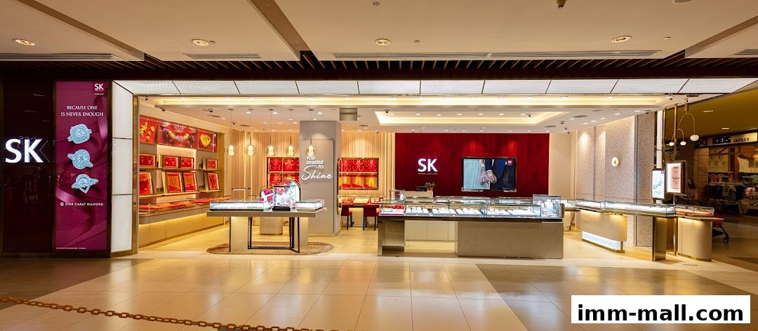 The interior of a well-lit SK Jewellery store showcasing display cases filled with jewelry.